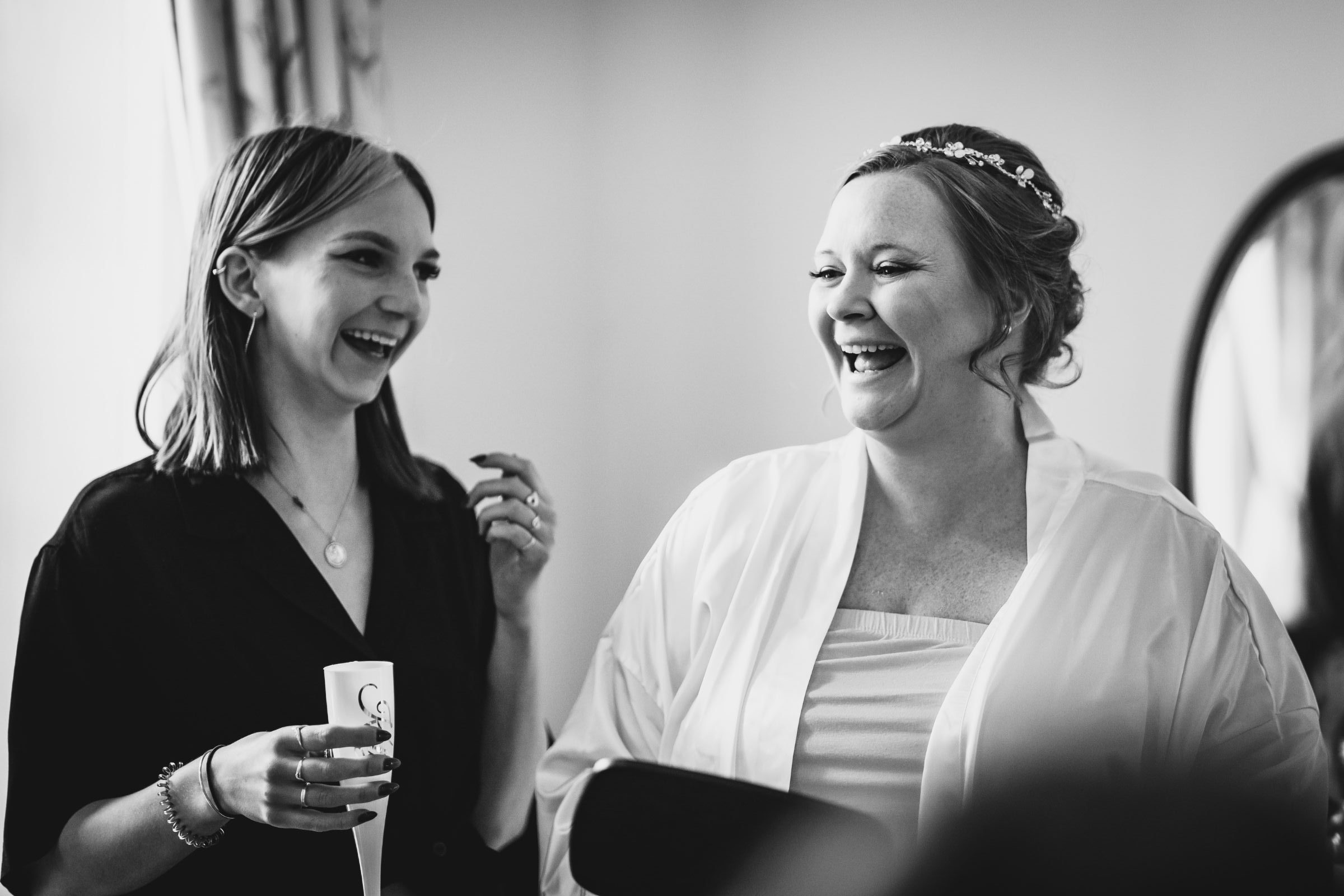 Bride enjoying her Cotswold wedding morning preparations with Florence Wear Mua